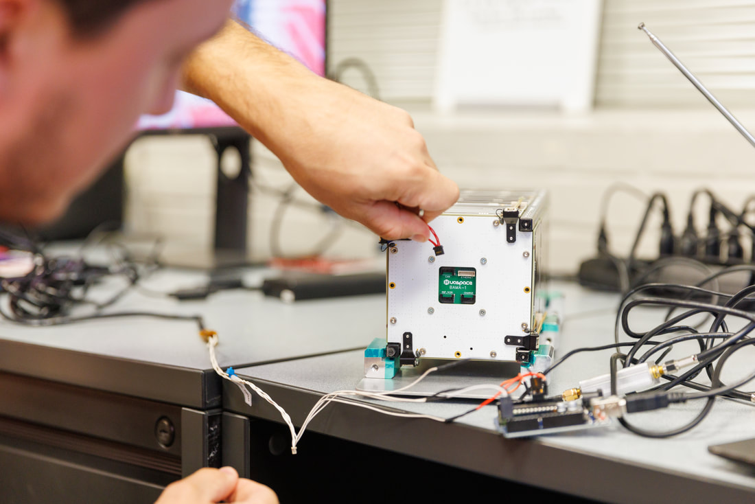 UA Space member works on the BAMA-1 cubesat.