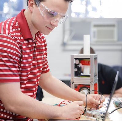 UASpace student works on a satellite's ground station.
